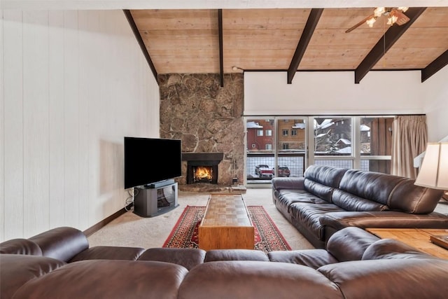 living room featuring a fireplace, wooden walls, lofted ceiling with beams, and wooden ceiling