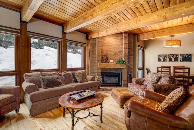 living area with wooden ceiling, a fireplace, and hardwood / wood-style flooring