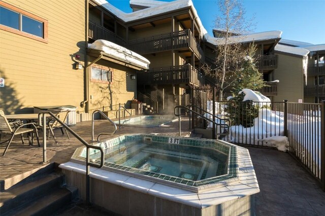 exterior space with a patio and a community hot tub