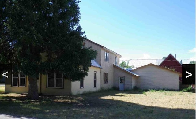 view of home's exterior featuring a lawn