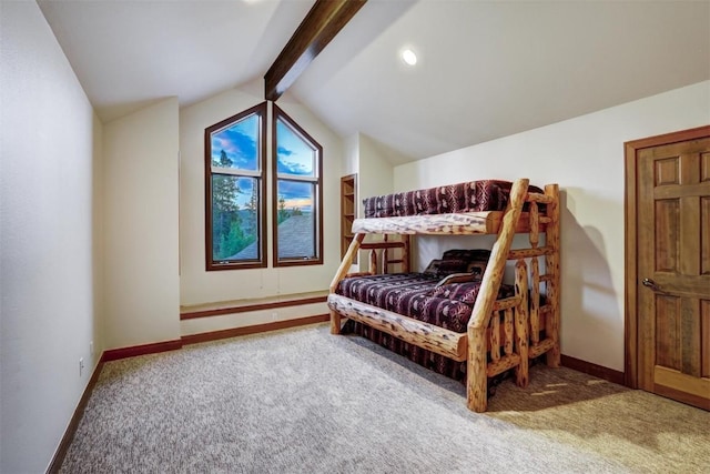 carpeted bedroom with vaulted ceiling with beams