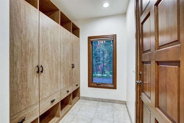 mudroom with light tile patterned floors