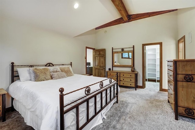 bedroom featuring carpet, a walk in closet, beam ceiling, high vaulted ceiling, and a closet