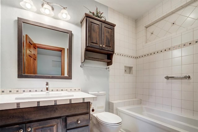 full bathroom featuring vanity, toilet, and tiled shower / bath combo