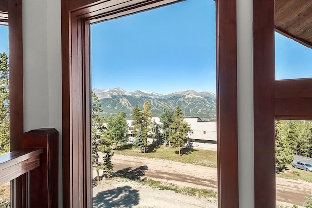 doorway to outside featuring a mountain view