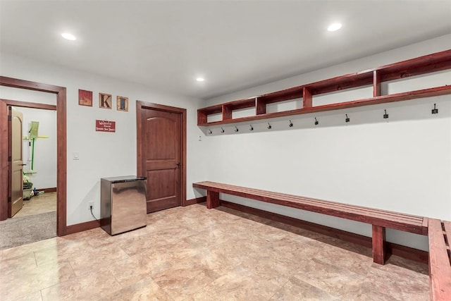 mudroom with recessed lighting and baseboards