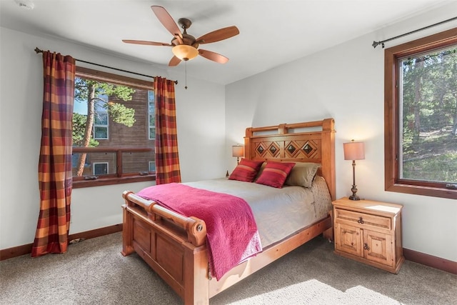 bedroom featuring baseboards, a ceiling fan, and light colored carpet