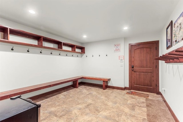 mudroom with recessed lighting and baseboards