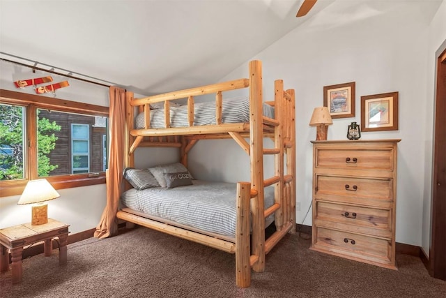 carpeted bedroom with lofted ceiling, a ceiling fan, and baseboards