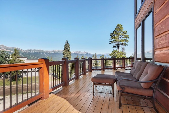 wooden terrace with a mountain view