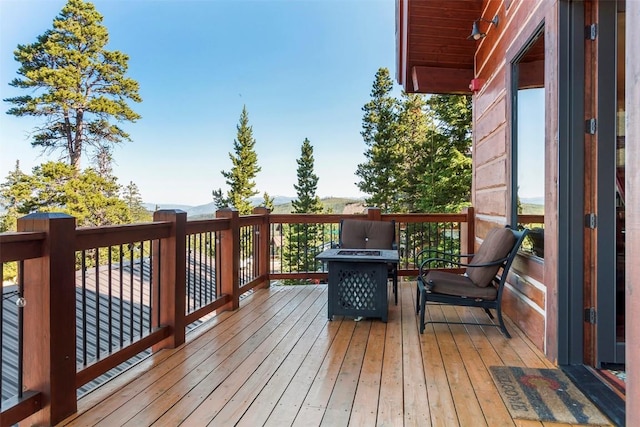 wooden deck with a mountain view