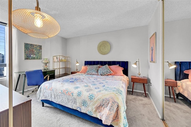 bedroom featuring a textured ceiling and carpet