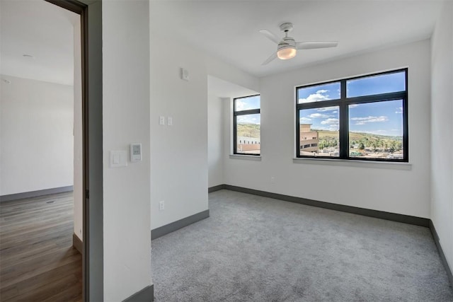 unfurnished room with ceiling fan