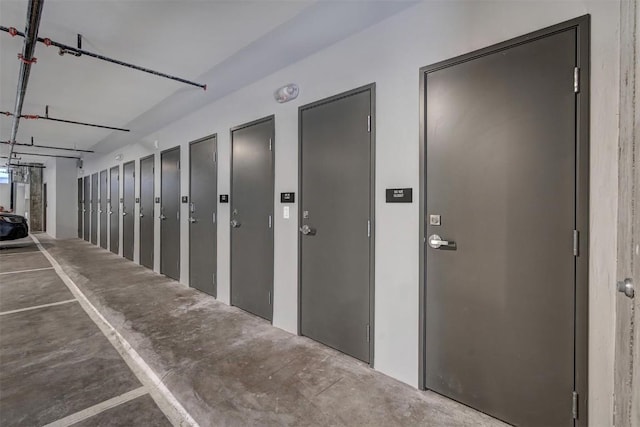 corridor with concrete flooring