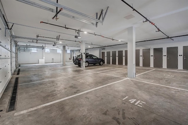 garage with electric panel and a garage door opener