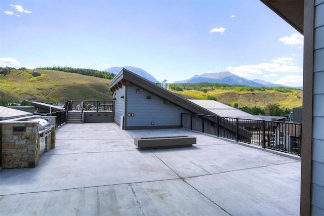 view of patio featuring a mountain view