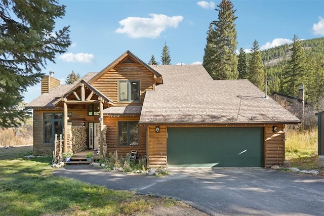 cabin featuring a garage