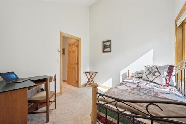 bedroom with light colored carpet