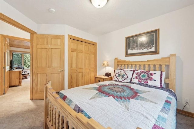 carpeted bedroom with a closet