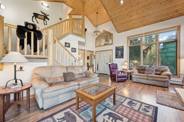 living room with hardwood / wood-style flooring, high vaulted ceiling, and wood ceiling