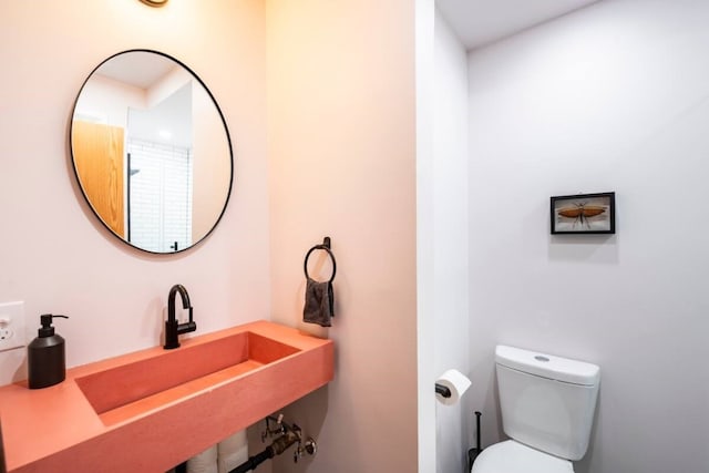 bathroom with toilet and sink