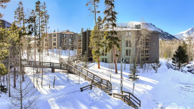 snow covered building with a mountain view