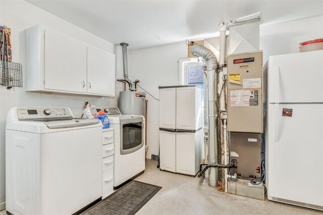 washroom with cabinets and separate washer and dryer