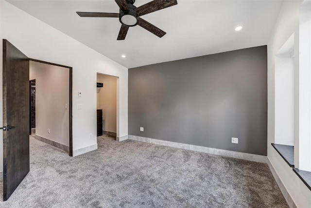 unfurnished bedroom featuring ceiling fan, light carpet, and lofted ceiling