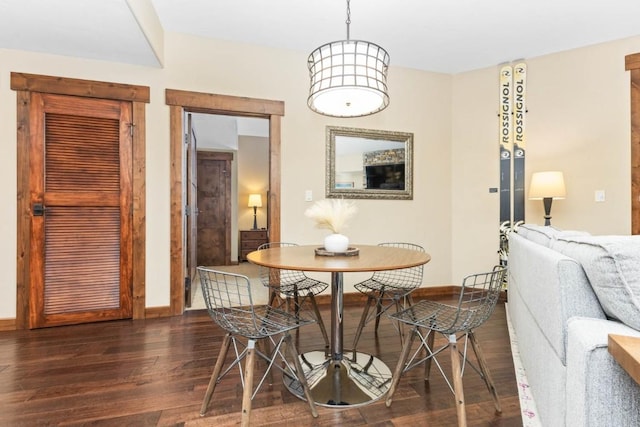 dining area with dark wood-type flooring