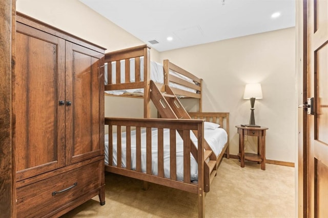 bedroom featuring light carpet