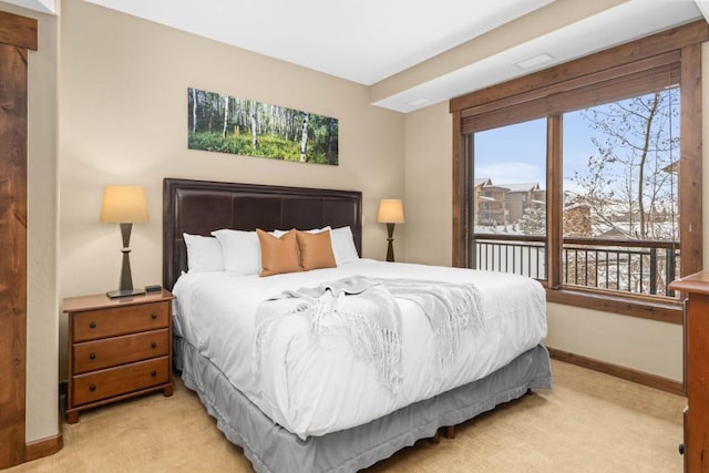 bedroom featuring light colored carpet