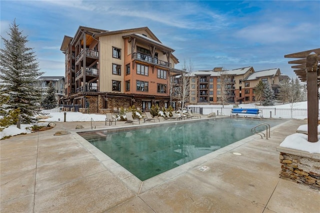 view of swimming pool featuring a patio area