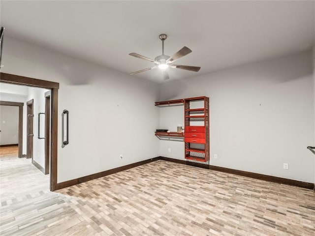 empty room with light hardwood / wood-style floors and ceiling fan