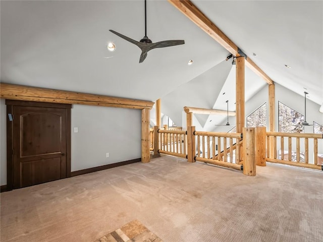 additional living space featuring ceiling fan, carpet floors, and vaulted ceiling with beams