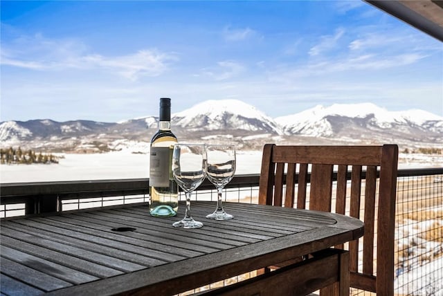 wooden deck featuring a mountain view