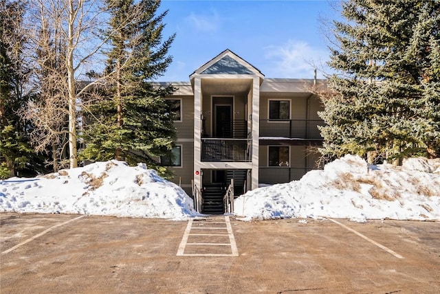 view of front of home featuring stairway