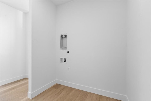 laundry room featuring electric dryer hookup, washer hookup, and light hardwood / wood-style floors