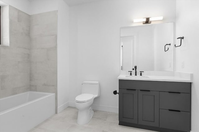 full bathroom featuring tiled shower / bath, vanity, and toilet