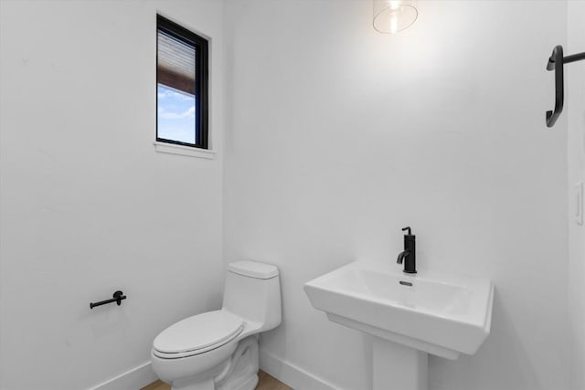 bathroom with sink and toilet