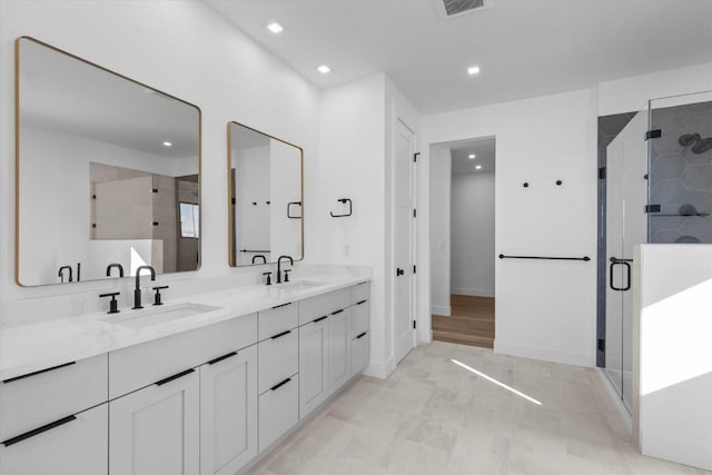 bathroom featuring vanity and walk in shower