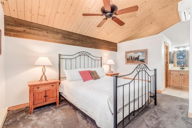 bedroom featuring carpet floors, ensuite bathroom, ceiling fan, and wood ceiling