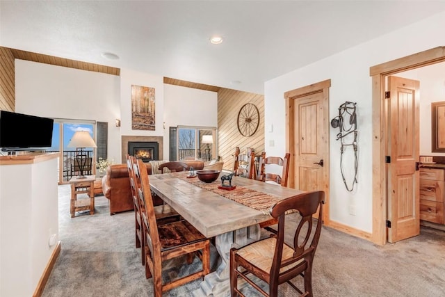 dining space with light colored carpet