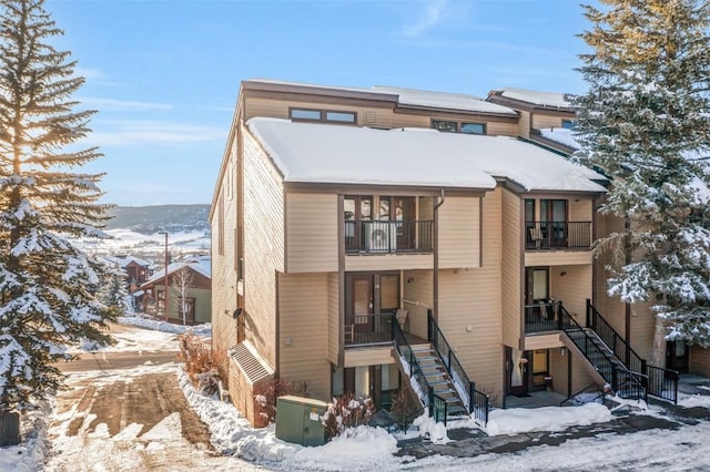 view of snow covered house