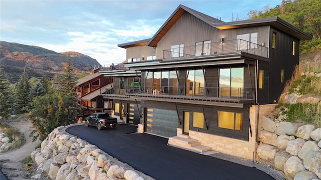 rear view of property with a mountain view