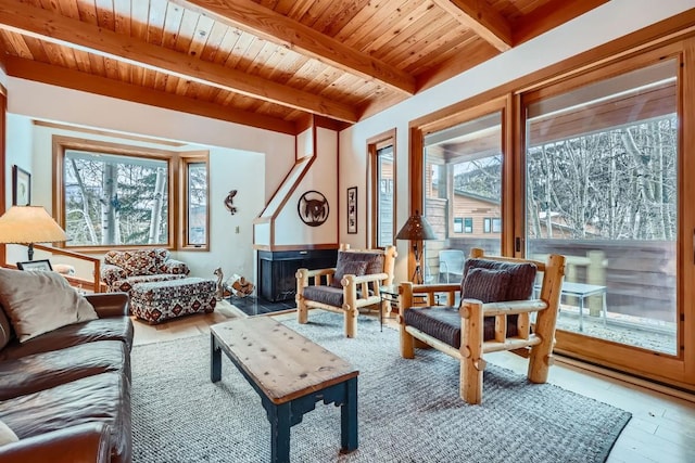 sunroom featuring wooden ceiling and beamed ceiling