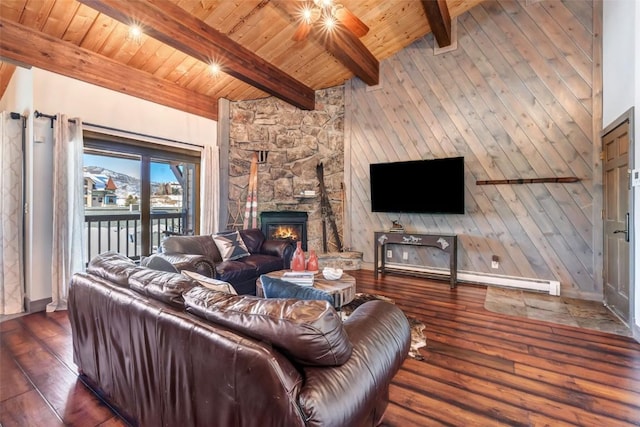 living room featuring beamed ceiling, dark hardwood / wood-style floors, wooden ceiling, and a fireplace