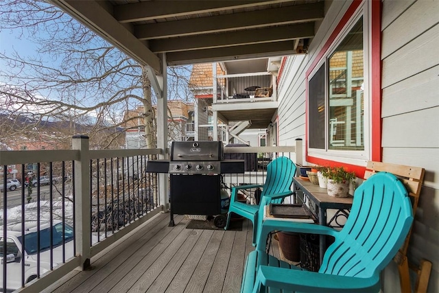 wooden deck featuring grilling area