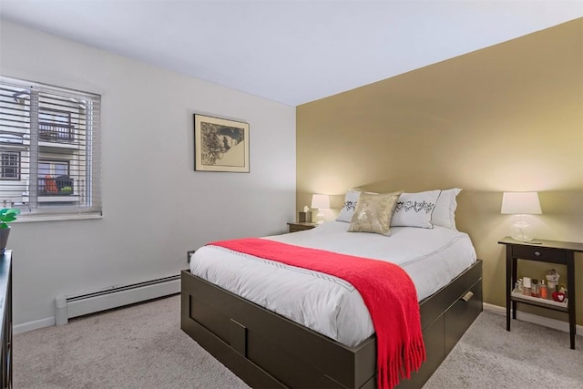 bedroom featuring baseboard heating and light colored carpet