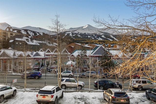 snow covered parking with a mountain view