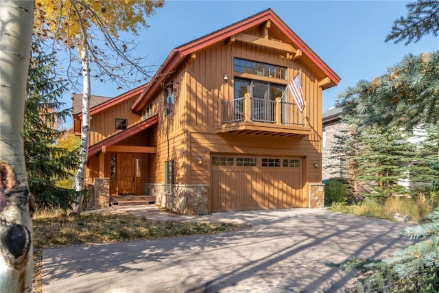 view of front of home with a balcony and a garage